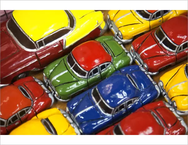 Rows of colourful model traditional American cars for sale to tourists
