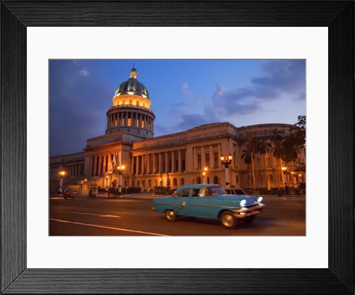 Framed Print : Traditional old American car speeding past the Capitolio building at night