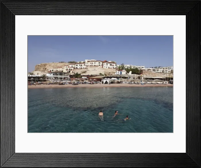 Framed Print : Swimmers enjoy the clear Red Sea waters at Sharks Bay, Sharm el-Sheikh Framed Print : Swimmers enjoy the clear Red Sea waters at Sharks Bay, Sharm el-Sheikh