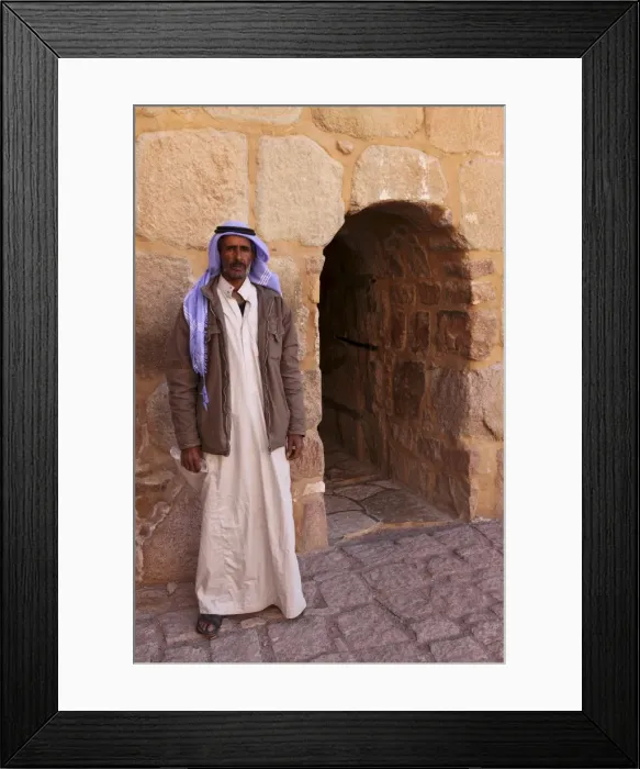 Framed Print : The gate keeper stands by the single entrance to the UNESCO World Heritage Site of St Framed Print : The gate keeper stands by the single entrance to the UNESCO World Heritage Site of St