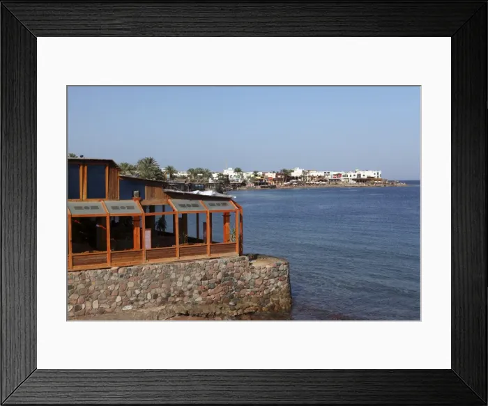 Framed Print : A restaurant overlooks the harbour of the Red Sea resort town of Dahab in Egypt Framed Print : A restaurant overlooks the harbour of the Red Sea resort town of Dahab in Egypt