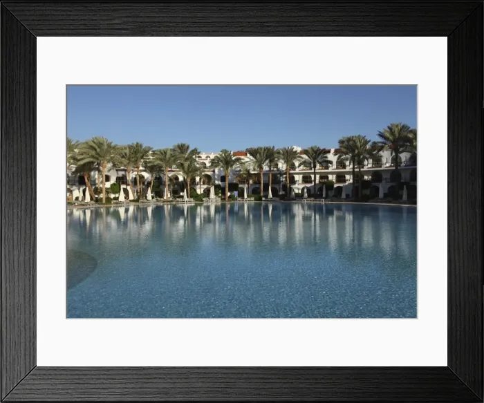 Framed Print : Rooms with verandas overlook a palm fringed swimming pool within the Royal Savoy Resort at Sharm el-Sheikh, Egypt, North Framed Print : Rooms with verandas overlook a palm fringed swimming pool within the Royal Savoy Resort at Sharm el-Sheikh, Egypt, North
