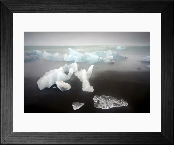 Framed Print : Icebergs from the Jokulsarlon glacial lagoon washed up on a nearby black volcanic sand beach from the North Atlantic Ocean, Iceland Framed Print : Icebergs from the Jokulsarlon glacial lagoon washed up on a nearby black volcanic sand beach from the North Atlantic Ocean, Iceland