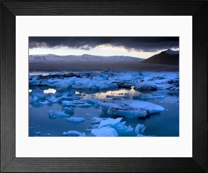 Framed Print : Blue icebergs floating on the Jokulsarlon glacial lagoon at sunset, South Iceland Framed Print : Blue icebergs floating on the Jokulsarlon glacial lagoon at sunset, South Iceland