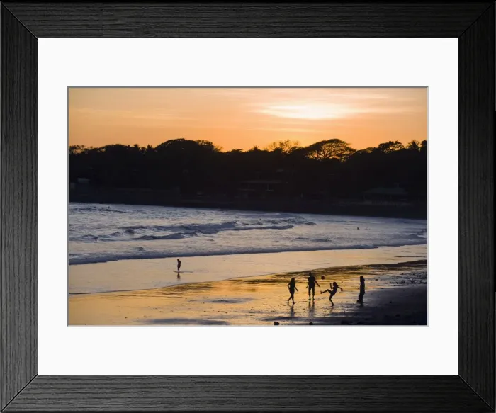 Framed Print : People playing football on the beach at La Libertad, Pacific Coast, El Salvador