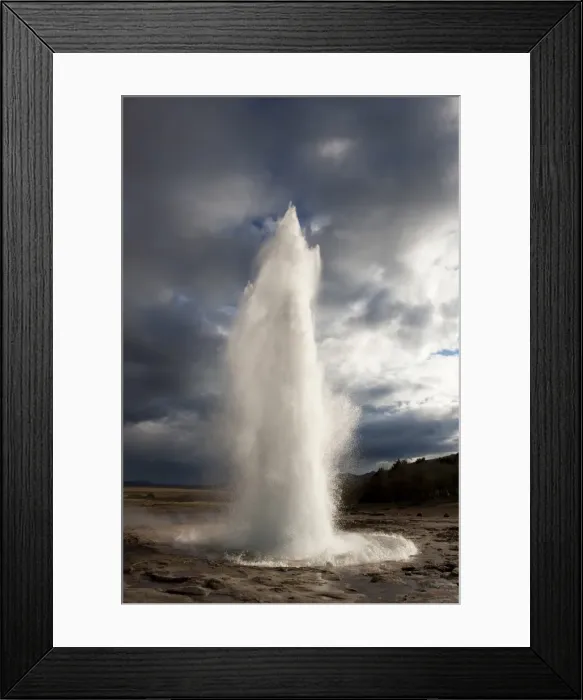 Framed Print : Water spout from Strokkur Geysir exploding into the sky on a stormy evening Framed Print : Water spout from Strokkur Geysir exploding into the sky on a stormy evening