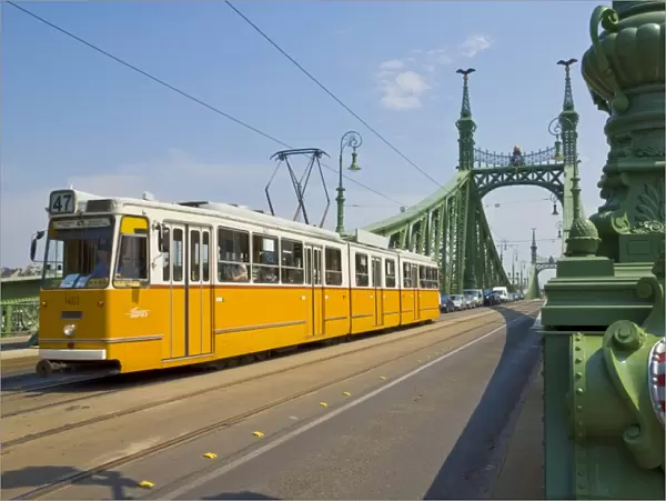 Yellow tram on The Liberty Bridge (Szabadsag hid), over the Rver Danube