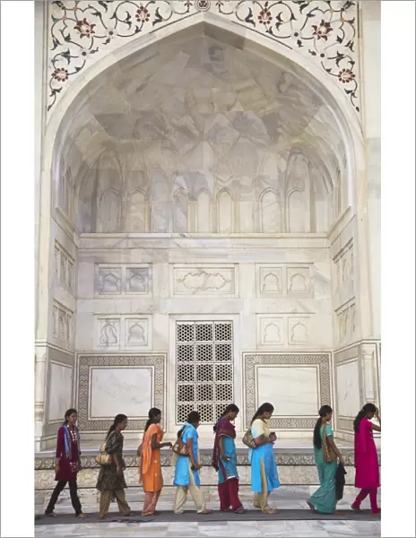 Indian women standing in line at Taj Mahal, UNESCO World Heritage Site