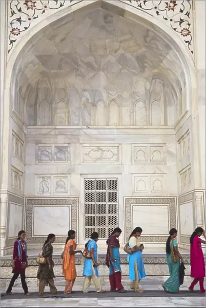 Indian women standing in line at Taj Mahal, UNESCO World Heritage Site