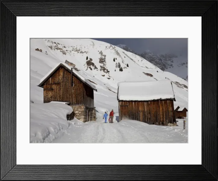 Framed Print : Winter walk on snowy path through wooden barns around San Pellegrino Pass Framed Print : Winter walk on snowy path through wooden barns around San Pellegrino Pass