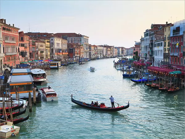 A gondola crossing the Grand Canal, Venice, UNESCO World Heritage Site