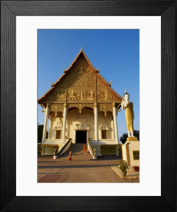 Framed Print : Statue of standing Buddha and monks, Pha That Luang temple, Vientiane, Laos Framed Print : Statue of standing Buddha and monks, Pha That Luang temple, Vientiane, Laos