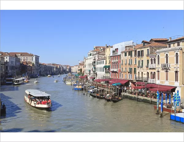 A vaporetto waterbus on the Grand Canal, Venice, UNESCO World Heritage Site