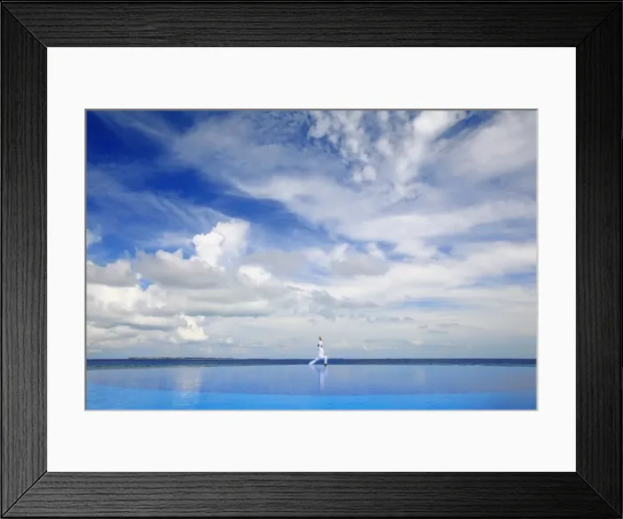 Framed Print : Young man meditating by infinity pool, Maldives, Indian Ocean, Asia Framed Print : Young man meditating by infinity pool, Maldives, Indian Ocean, Asia