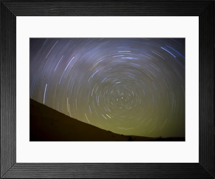 Framed Print : Star trails captured using an exposure time of two hours to record the rotation of the earth on its Polar Axis, stars are rotating around the Pole Star (Polaris), the Sahara Desert near Merzouga, Morocco, North Framed Print : Star trails captured using an exposure time of two hours to record the rotation of the earth on its Polar Axis, stars are rotating around the Pole Star (Polaris), the Sahara Desert near Merzouga, Morocco, North