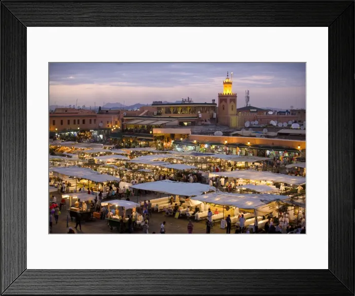 Framed Print : View over Djemaa el Fna at dusk with foodstalls that are set-up daily to serve tourists Framed Print : View over Djemaa el Fna at dusk with foodstalls that are set-up daily to serve tourists