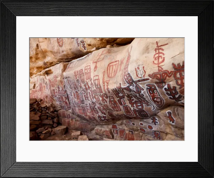 Framed Print : Sacred rock paintings on cliff depicting Dogon customs and stories in Songo Framed Print : Sacred rock paintings on cliff depicting Dogon customs and stories in Songo
