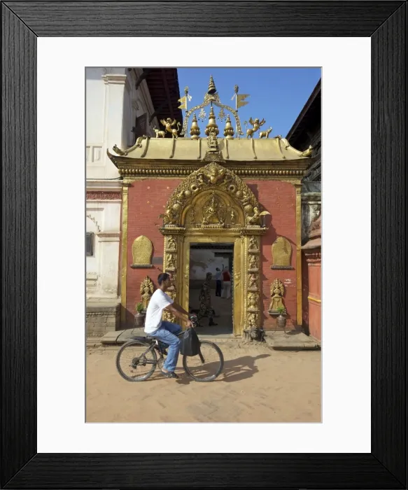 Framed Print : Man cycling past the Golden Gate, Sun Dhoka, in Durbar Square, Bhaktapur Framed Print : Man cycling past the Golden Gate, Sun Dhoka, in Durbar Square, Bhaktapur