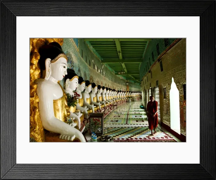Framed Print : Monk walking past Buddha statues in a crescent shaped colonnade in Umin Thounzeh Framed Print : Monk walking past Buddha statues in a crescent shaped colonnade in Umin Thounzeh