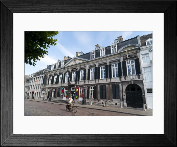 Framed Print : Man riding in front of the Theater Aan Het Vrijthof, Vrijthof Square, Mstricht