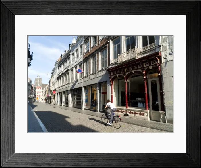 Framed Print : Guy riding bicycle in Grote Staat, the main commercial street, Mstricht