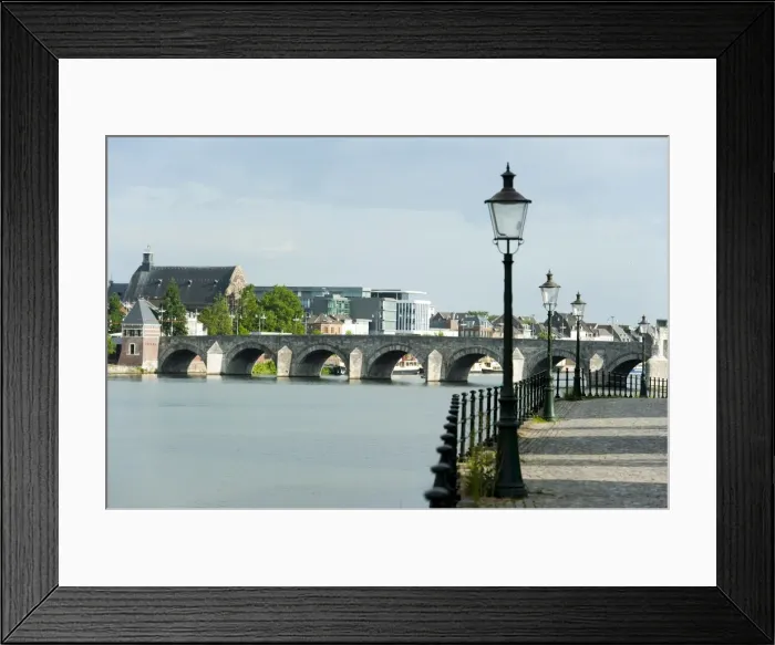Framed Print : River Ms and Saint Servatius Bridge seen from the Stenenwall (Stone Wall)