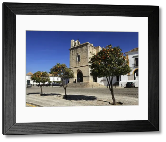Framed Print : Orange trees grow outside of the Cathedral (Se) in the Old Town of Faro Framed Print : Orange trees grow outside of the Cathedral (Se) in the Old Town of Faro