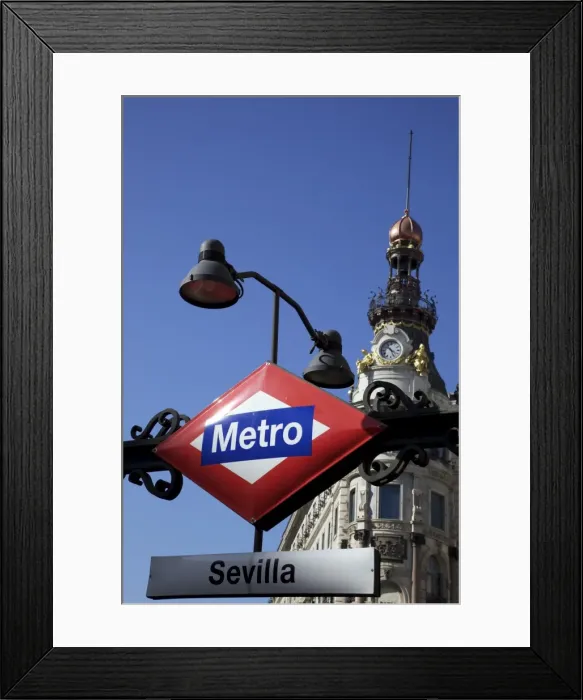Framed Print : Sevilla Metro station sign in front of the Banco Espanol de Credito building Framed Print : Sevilla Metro station sign in front of the Banco Espanol de Credito building