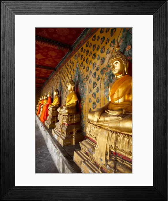 Framed Print : A row of golden seated Buddha statues located inside Wat Arun (The Temple of the Dawn) Framed Print : A row of golden seated Buddha statues located inside Wat Arun (The Temple of the Dawn)