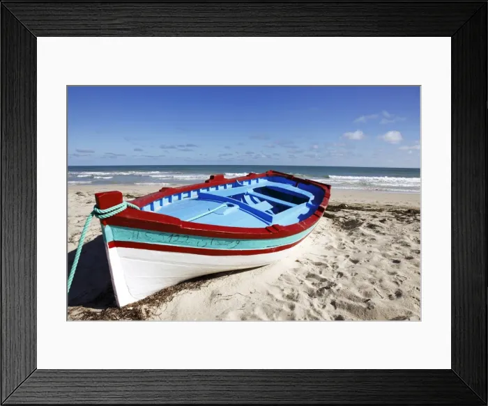 Framed Print : Small boat on tourist beach the Mediterranean Sea, Djerba Island, Tunisia Framed Print : Small boat on tourist beach the Mediterranean Sea, Djerba Island, Tunisia