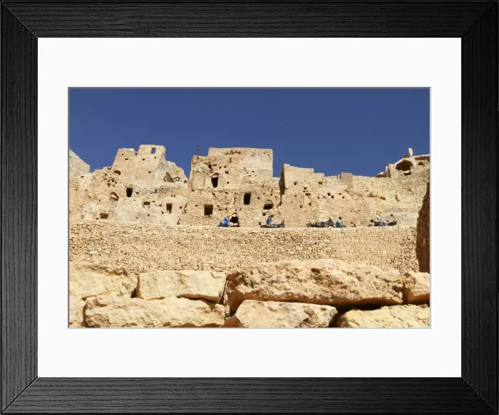 Framed Print : Troglodyte cave dwellings and local workers using donkeys, hillside Berber village of Chenini Framed Print : Troglodyte cave dwellings and local workers using donkeys, hillside Berber village of Chenini