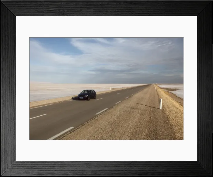 Framed Print : Chott El Jerid, a flat dry salt lake, and automobile on highway between Tozeur and Kebili Framed Print : Chott El Jerid, a flat dry salt lake, and automobile on highway between Tozeur and Kebili