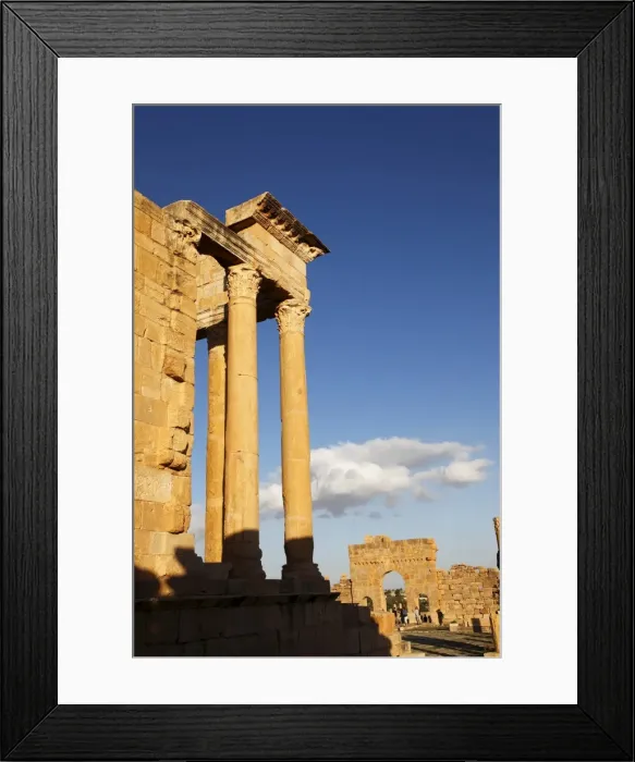 Framed Print : Columns of the Capitol and Arch of Antoninus Pius in the Forum at the Roman ruins of Sbeitla Framed Print : Columns of the Capitol and Arch of Antoninus Pius in the Forum at the Roman ruins of Sbeitla