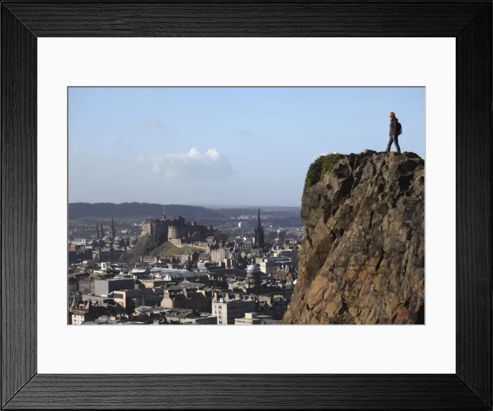 Framed Print : A tourist on Arthurs Seat looking towards the castle and skyline of Auld Reekie Framed Print : A tourist on Arthurs Seat looking towards the castle and skyline of Auld Reekie