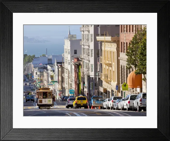Framed Print : One of the famous cable cars on the Powell-Mason track, with the island of Alcatraz in the background, San Francisco, California, United States of America Framed Print : One of the famous cable cars on the Powell-Mason track, with the island of Alcatraz in the background, San Francisco, California, United States of America