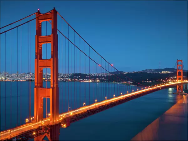 The Golden Gate Bridge, from the Marin Headlands at night with the city of San Francisco in the background and traffic light trails across the bridge, Marin County, San Francisco, California, United States of America
