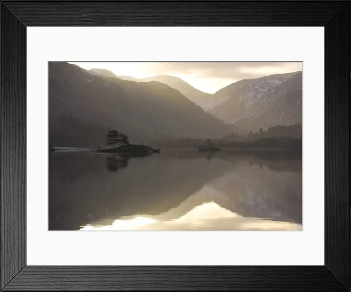 Framed Print : Morning sunlight bursting through clouds over fells with reflections in Lake Ullswater Framed Print : Morning sunlight bursting through clouds over fells with reflections in Lake Ullswater