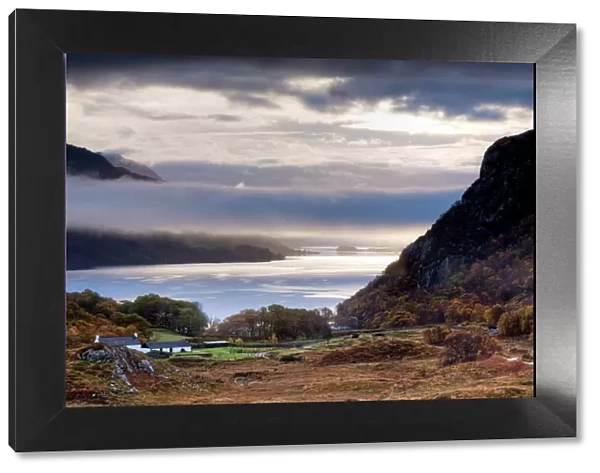 Early morning mist hanging over Loch Maree with Tollie Farm in foreground