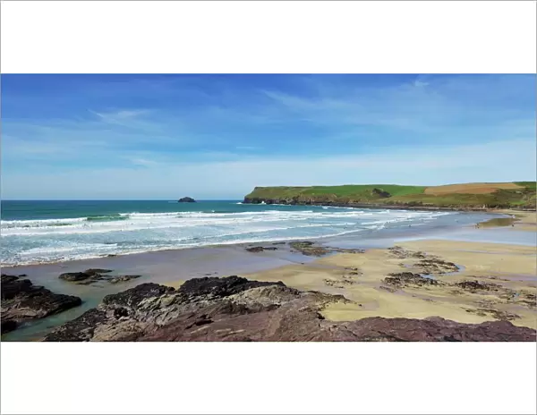 View of Atlantic surf at Polzeath beach, looking north to Pentire Headland