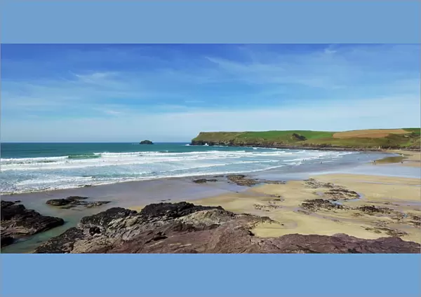 View of Atlantic surf at Polzeath beach, looking north to Pentire Headland