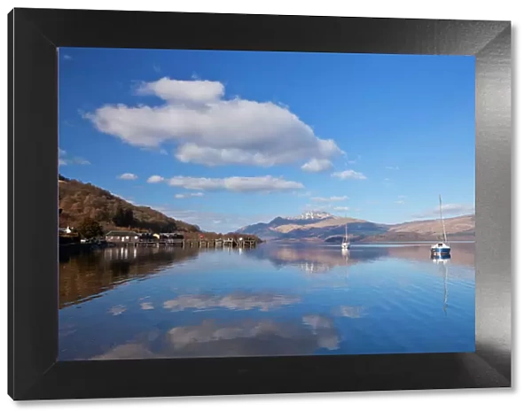 Picturesque tranquil Loch Lomond with sailing boats, Luss Jetty, Luss, Argyll and Bute