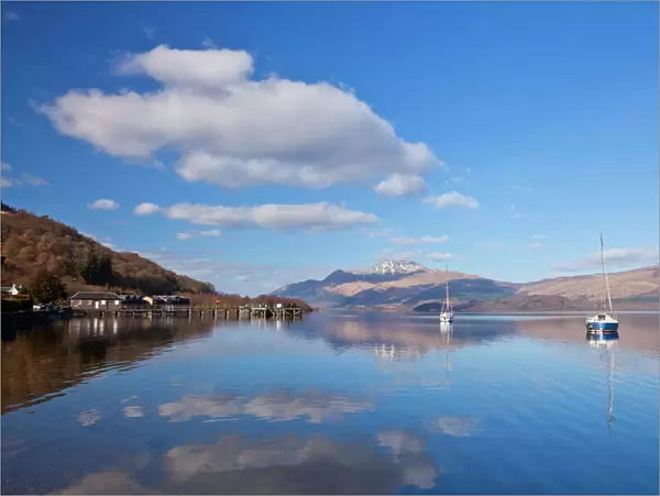 Picturesque tranquil Loch Lomond with sailing boats, Luss Jetty, Luss, Argyll and Bute