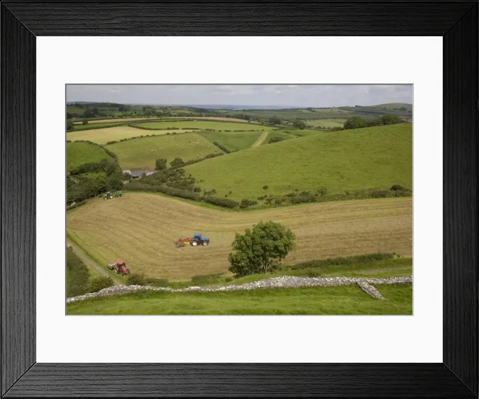 Framed Print : Tractors harvesting in field by Carreg Cennon, Brecon Beacons National Park Framed Print : Tractors harvesting in field by Carreg Cennon, Brecon Beacons National Park