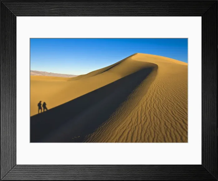 Framed Print : Shadows of two people walking up the dunes of the Mesquite Flats sand dunes Framed Print : Shadows of two people walking up the dunes of the Mesquite Flats sand dunes