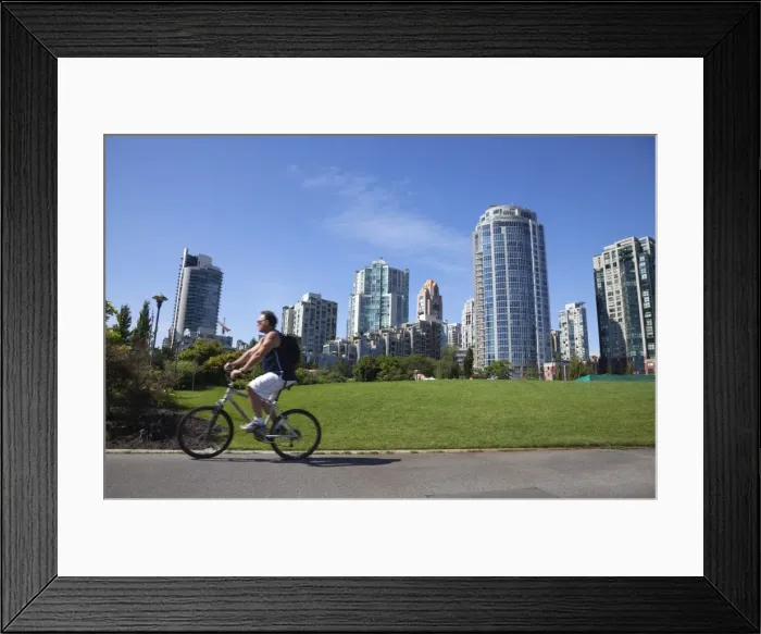 Framed Print : Cyclist passing apartment blocks, False Creek, Vancouver, British Columbia Framed Print : Cyclist passing apartment blocks, False Creek, Vancouver, British Columbia