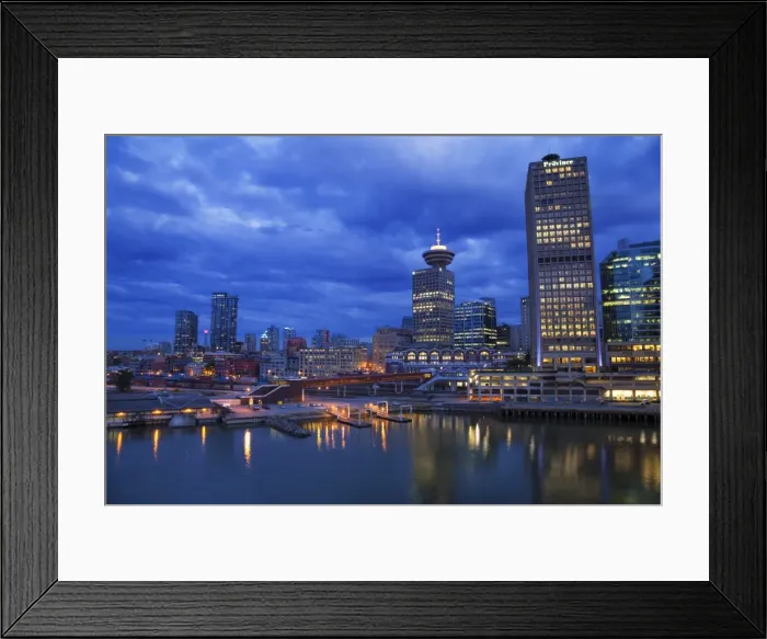 Framed Print : Skyline and the waterfront in the evening from Canada Place with the Seabus Terminal Framed Print : Skyline and the waterfront in the evening from Canada Place with the Seabus Terminal
