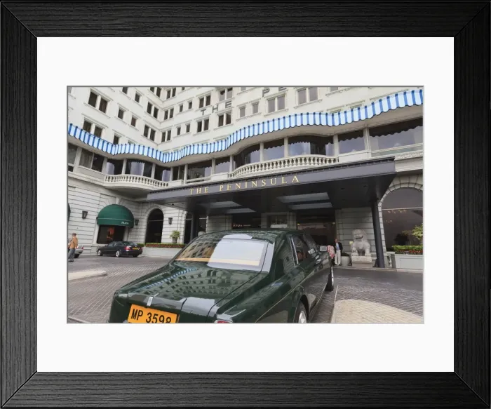 Framed Print : The Peninsula Hotel and one of the hotels fleet of green Rolls Royces Framed Print : The Peninsula Hotel and one of the hotels fleet of green Rolls Royces