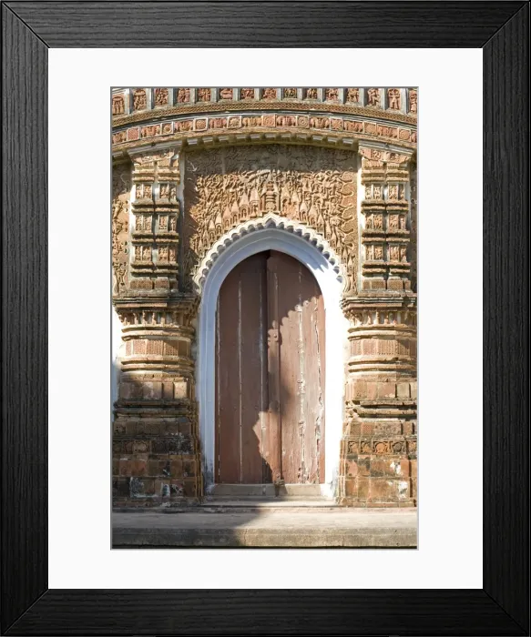 Framed Print : Ornate carving of Hindu myths above a door in the restored miniature terracotta Hindu temple in Baranagar, rural West Bengal