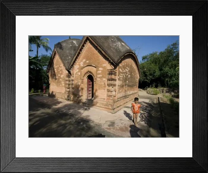 Framed Print : Young village girl beside restored miniature terracotta Hindu temple to Shiva Framed Print : Young village girl beside restored miniature terracotta Hindu temple to Shiva