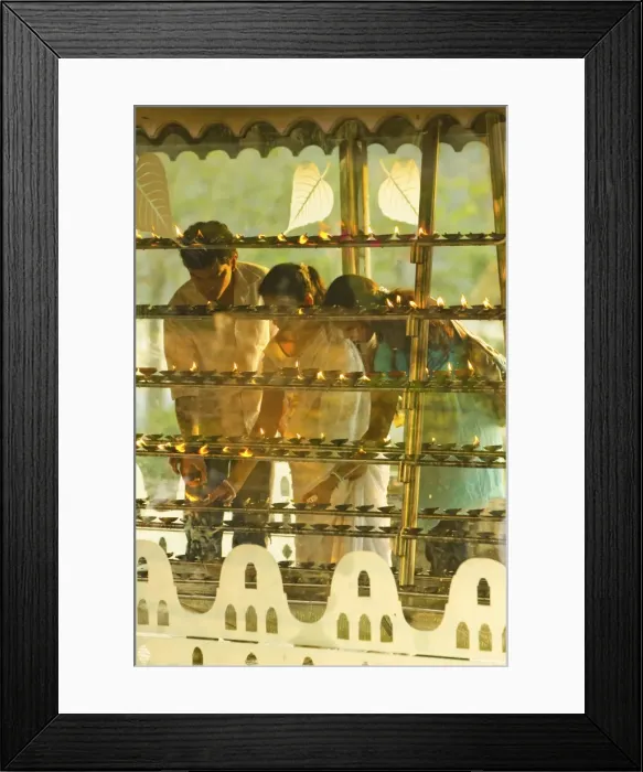 Framed Print : Devotees lighting candles at sunset in the Temple of the Sacred Tooth Relic Framed Print : Devotees lighting candles at sunset in the Temple of the Sacred Tooth Relic